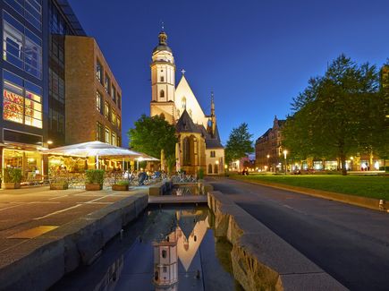 The illuminated St Thomas Church in Leipzig by night